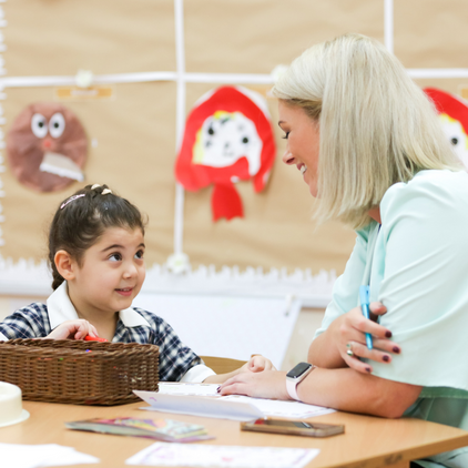 Nursery pupil with teacher at Brighton College Abu Dhabi 422 x 422